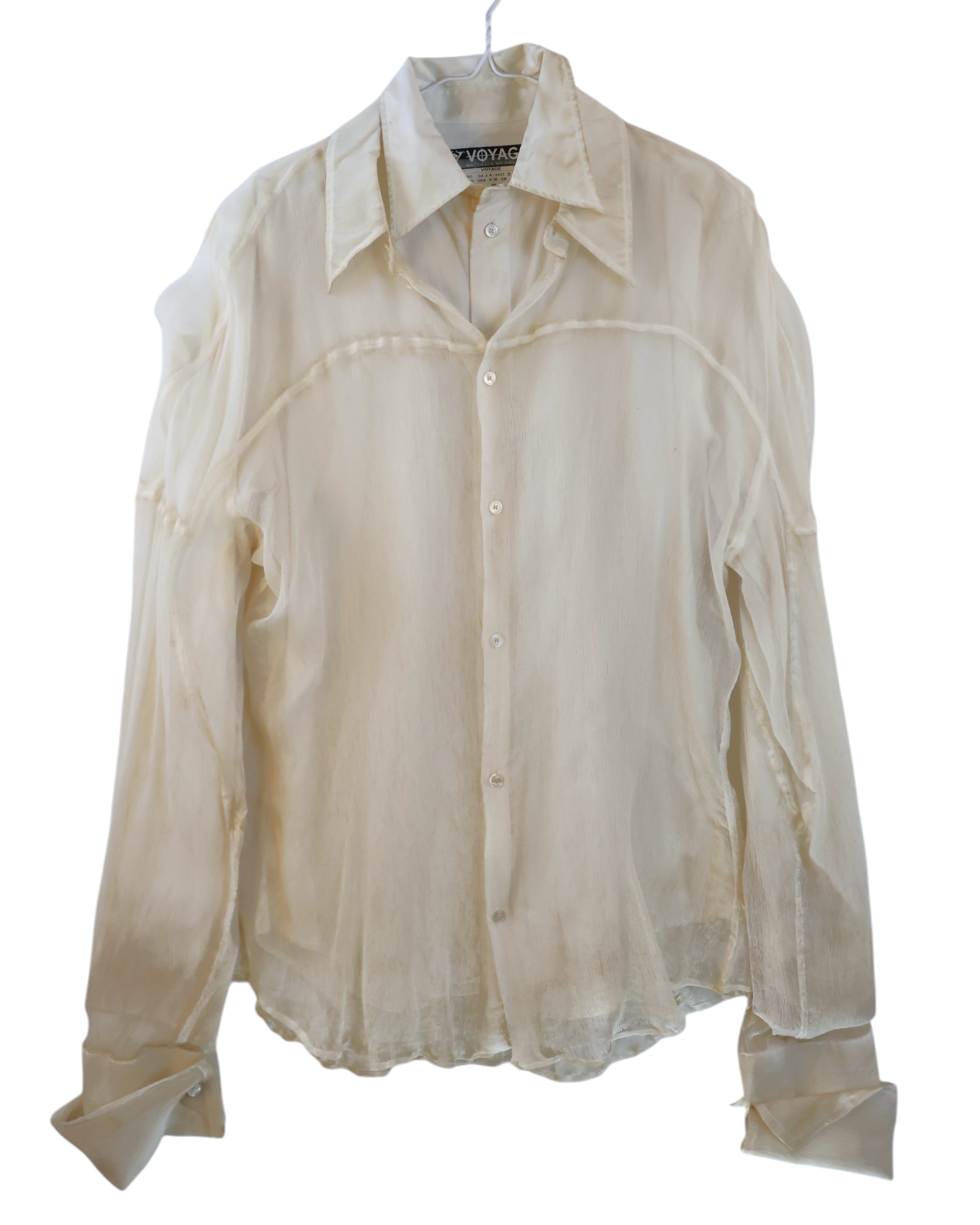 Voyage Mazzilli & Michielsens ivory/cream double-layer long-sleeve button-up shirt/blouse; semi-sheer gauze/chiffon effect with overlay construction, deconstructed chest seam, exaggerated collar, tonal buttons, soft drape; relaxed/unisex layer for tailoring, denim, evening; artisanal/avant-garde/romantic/minimal/Y2K; Italian-Belgian label, made-in-Italy craft, rare archive piece.