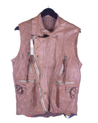 A beige leather vest with multiple zippers and a collar, displayed on a hanger. Christian Peau tan/beige leather moto vest; asymmetric snap collar, quilted shoulders, multi zip pockets with tassel pulls, dual zips, adjustable side tabs, patterned lining; matte silver hardware; relaxed unisex layering; great with denim, tees, boots; style tags: biker, workwear, bohemian, rugged, artisanal; brand context: Japanese leather atelier with European-inspired craft, small batch.