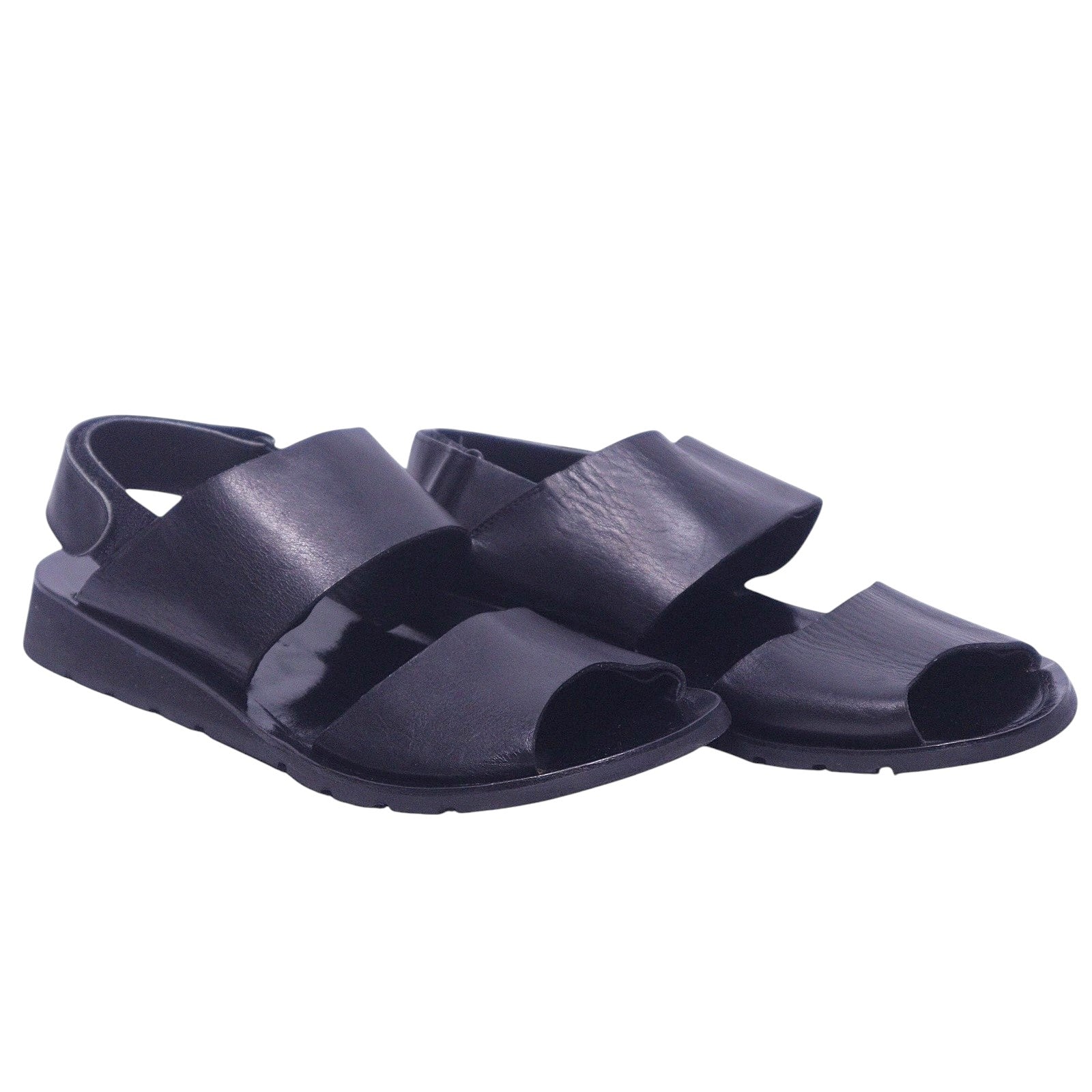 A pair of Yohji Yamamoto black leather strap sandals. Yohji Yamamoto men’s black leather sandals with wide straps, open toe, back strap, and rubber sole.