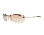 A pair of Gucci sunglasses with a metallic frame and pink gradient lenses. Gucci 1793/S sunglasses / shades; brown gradient rimless–semi-rimless rectangular wrap lenses, gold-tone metal temples with GUCCI logo; adjustable nose pads, lightweight UV protection; unisex fit for tailoring, casual or streetwear/Y2K looks; Italian luxury heritage house craftsmanship, often made in Italy; rare model, chic everyday eyewear.