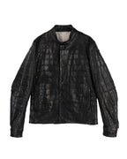 Isaac Sellam for L’Éclaireur black/ebony crocodile leather jacket; exotic croc-skin panels, collarless stand neck, snap-button front, straight hem, sculptural sleeves, clean seaming; matte/antique metal hardware; regular fit, unisex; pairs with denim, tailoring, streetwear; avant-garde, minimal, luxury, runway, collectible; brand context: French artisanal designer from Paris in collaboration with the famed Paris concept store; rare limited piece.
