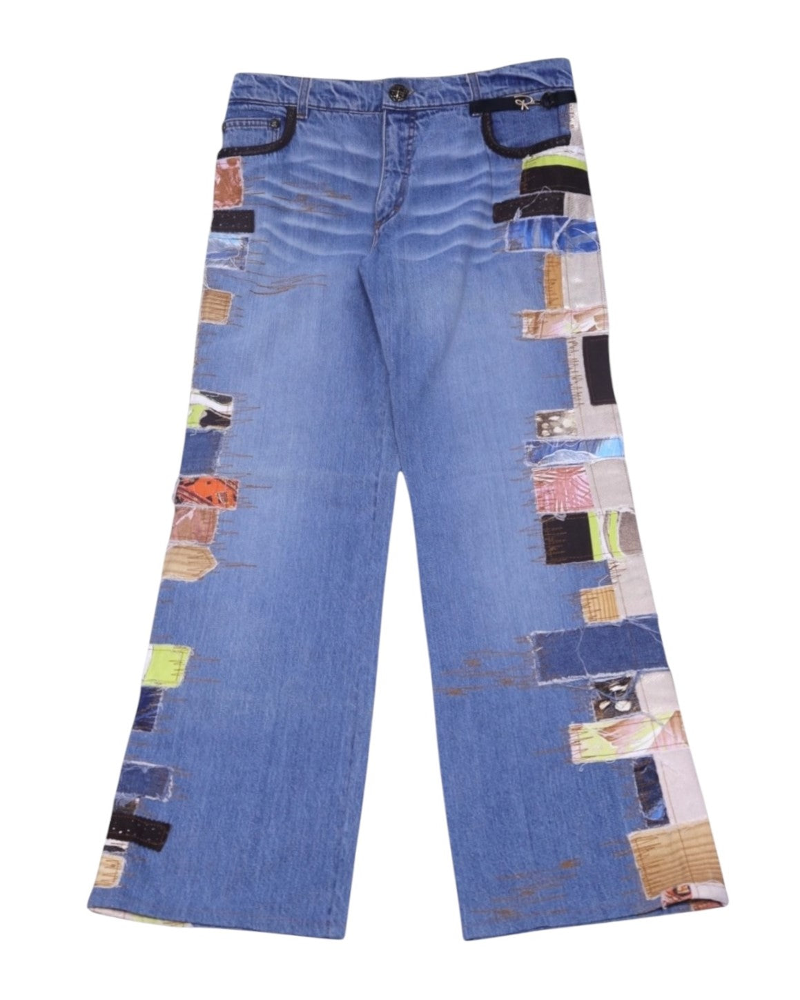 A pair of Roberto Cavalli patchwork denim jeans with various colorful fabric patches. Roberto Cavalli light blue patchwork denim jeans with multicolor fabric panels along both outer legs, black-trimmed pockets and gentle whiskering. Relaxed straight leg, five-pocket style with belt loops and zip fly; vintage designer, rare statement pair.