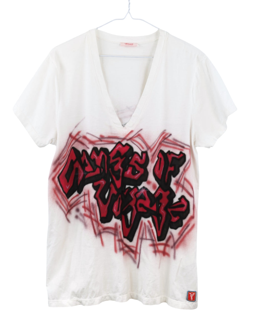 Vintage Voyage Mazzilli & Michielsens T-shirt — European artisanal/cult label; white cotton jersey V-neck tee with red/black graffiti airbrush/spray-paint artwork (“Gangs of Voyage”), streetwear/hip-hop/skate vibe; short sleeves, soft lightweight knit, relaxed/unisex fit; statement logo graphic, Y2K/90s style, rare collectible top.