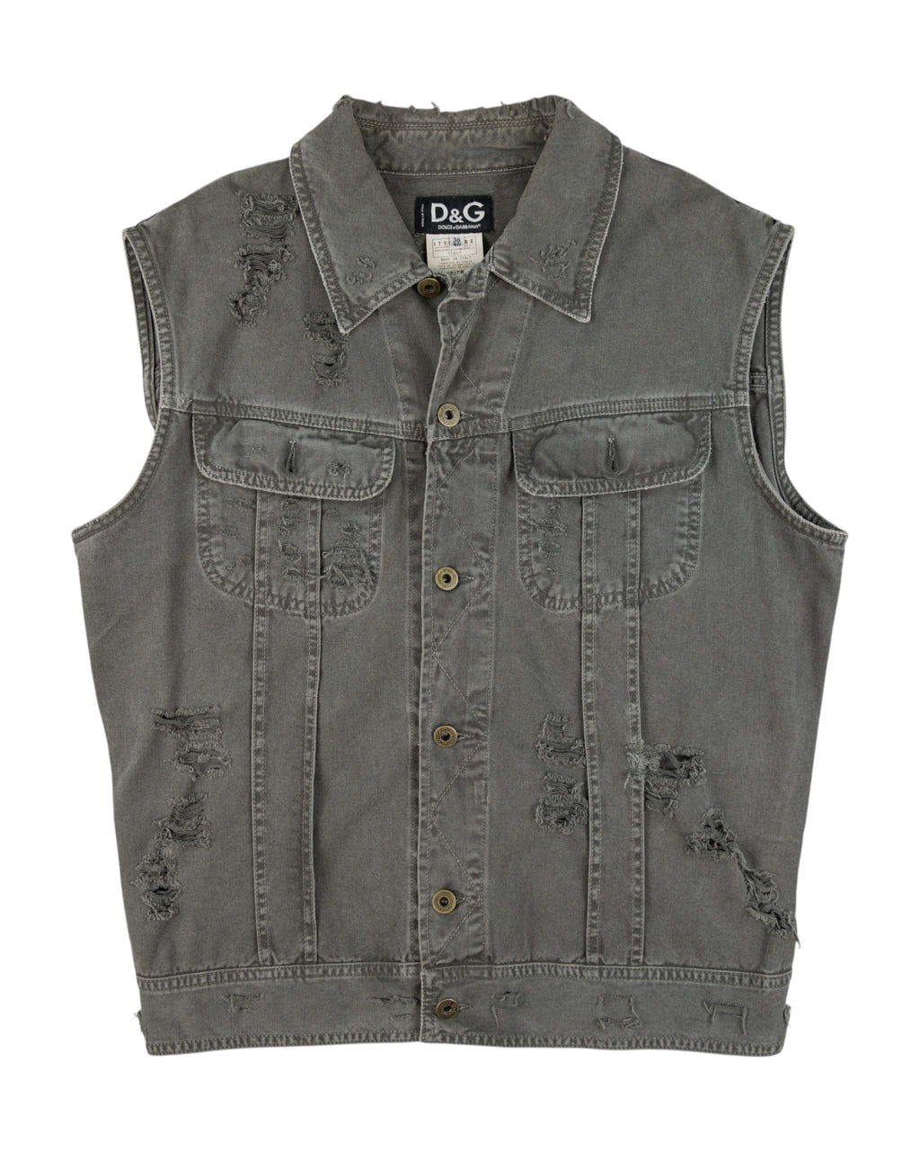 Dolce & Gabbana (D&G) grey denim vest / sleeveless trucker jacket—stonewashed cotton jean fabric, distressed/ripped details, button-front placket, flap chest pockets, raw edges; grunge/workwear street style layer for tees or hoodies; unisex fit. Italian luxury label from Milan known for sharp tailoring and artisanal finishes.