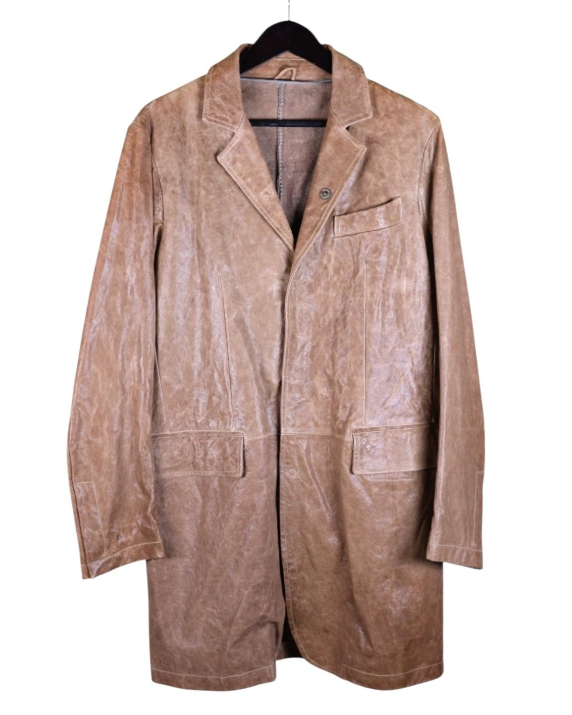 Giorgio Brato beige/tan/sand leather blazer-jacket — Italian artisanal label known for hand-dyed, washed leathers; supple lambskin with vintage patina, mid-length unstructured coat silhouette, notch lapels, single-breasted front, chest welt pocket and two large patch/flap pockets, clean seams, minimalist tailoring; luxury designer outerwear, made in Italy, versatile neutral for men or women.