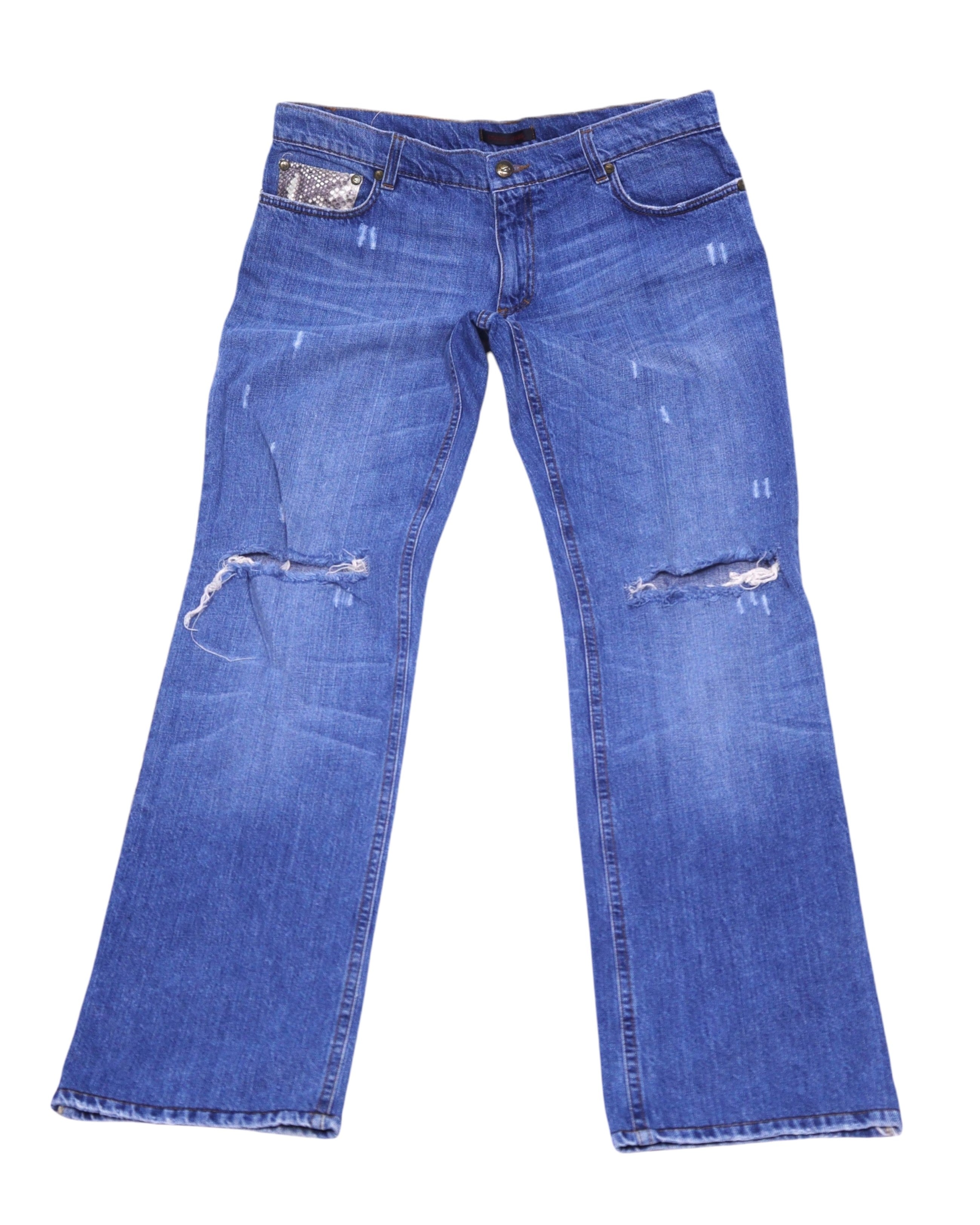 Vintage Roberto Cavalli medium-blue jeans/denim trousers with ripped knees and light fading. Straight-leg five-pocket style featuring a snakeskin-pattern coin pocket; luxury designer, rare and unique, laid flat on white.