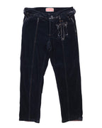 A pair of black velvet pants with a high waist, wide legs, and decorative belt loops. Black velvet trousers with straight legs and a soft sheen, featuring vertical seam lines, belt loops and a small studded utility pocket on the front. Vintage designer vibe, unique and rare.