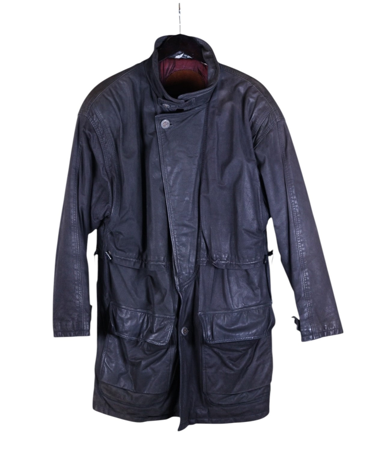 Vintage Bilermain long leather coat — designer outerwear with military/utility inspiration; longline parka/field-coat/duster silhouette in supple black/charcoal leather with rich patina; stand collar with throat latch, asymmetric storm-flap front, hidden zip + button placket; drawstring/adjustable waist, four oversized cargo/bellows pockets, adjustable cuffs; fully lined, rugged yet refined; unisex trench/overcoat statement piece; rare collectible.