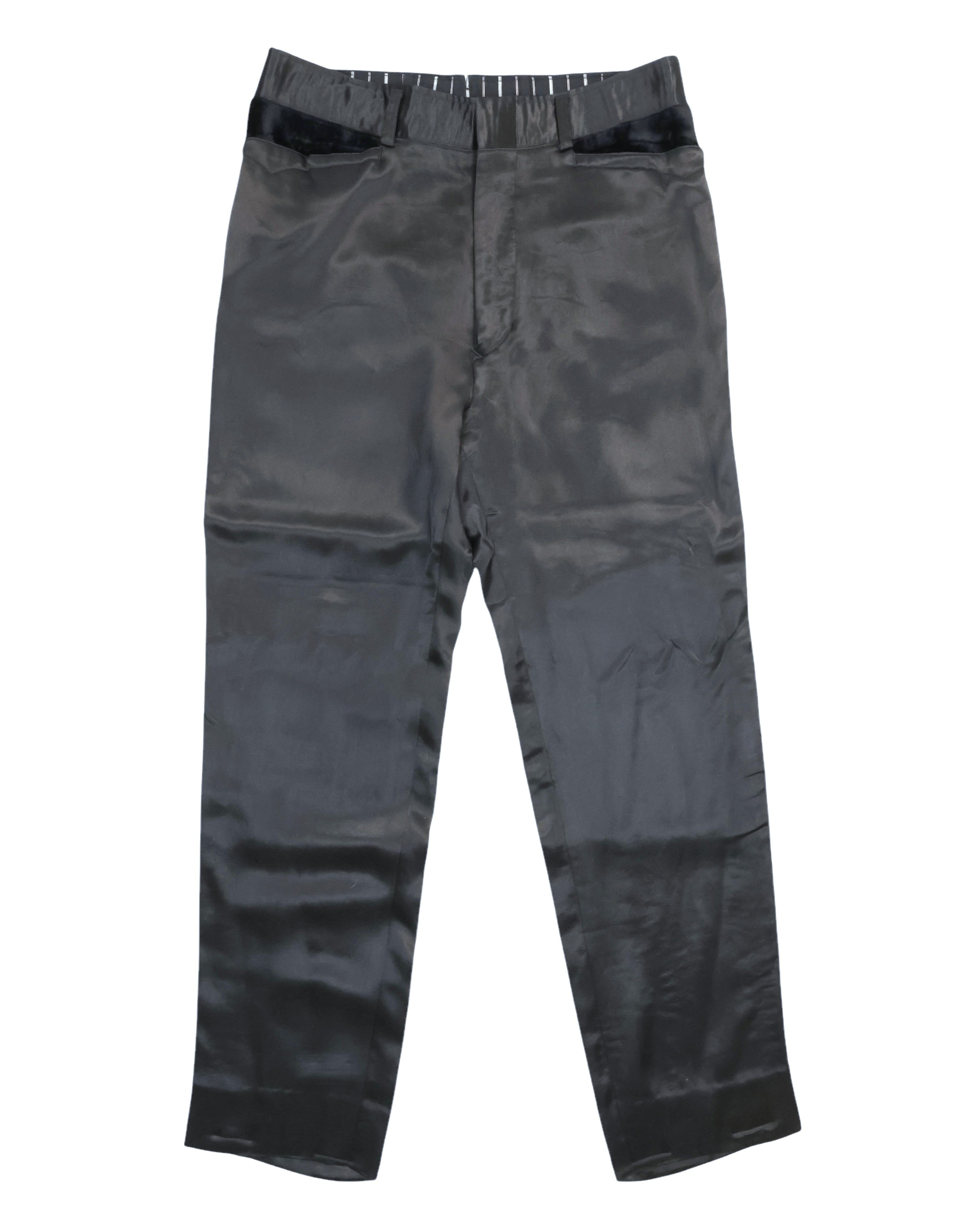 Vintage Matsuda Nicole (Tokyo) black trousers in lustrous satin-like fabric, flat front with cropped straight leg and clean hems. Minimalist tailored style with contrast glossy waistband tabs and belt loops; rare, high-end designer piece laid flat on white.