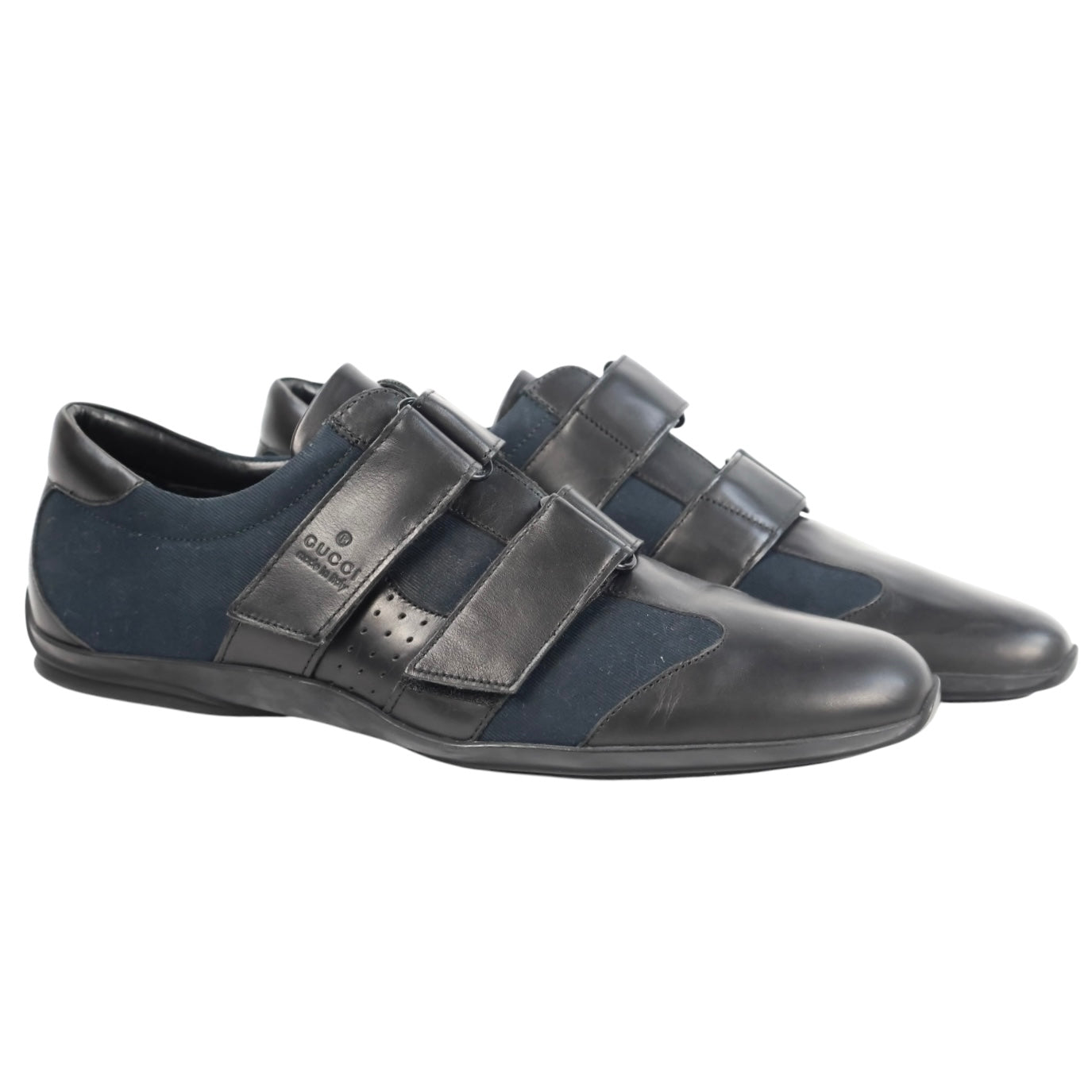Vintage Gucci black leather and navy canvas sneakers/trainers — low-top designer shoes with triple Velcro (hook-and-loop) straps, round toe, rubber sole, and logo strap (men’s/unisex).
