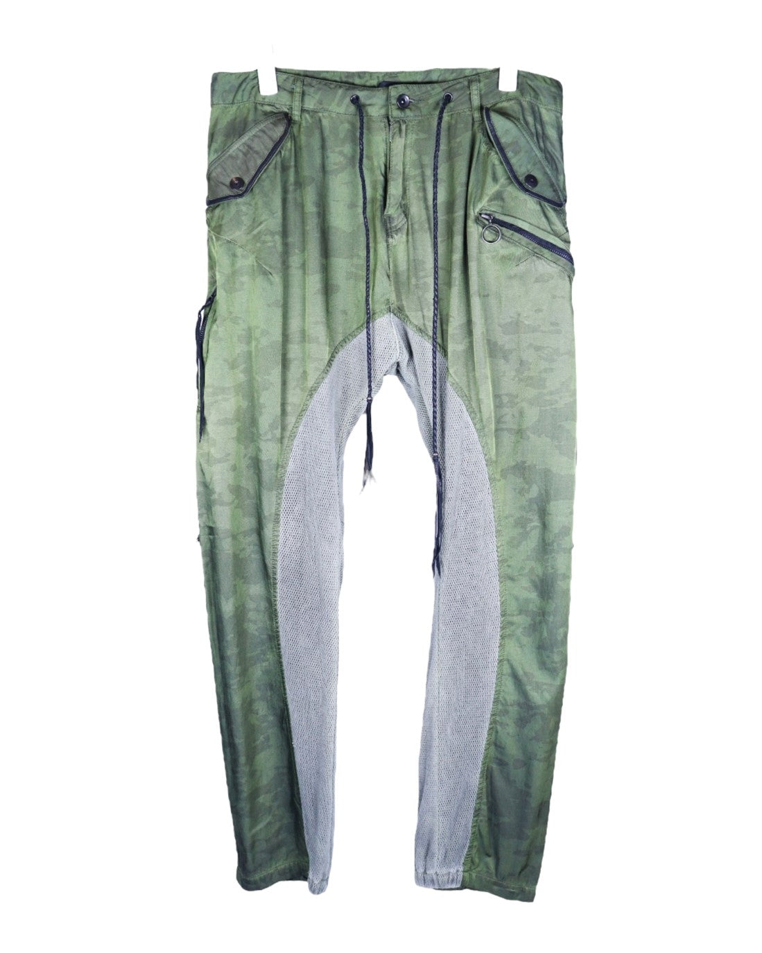 Vintage KMRii camouflage sweatpants/joggers in army-green, with long drawstrings, relaxed tapered legs and contrast grey mesh gusset panels. Angled zip pocket with ring pull, snap-flap pockets and utilitarian seaming; luxury techwear streetwear, rare and unique, laid flat on white.