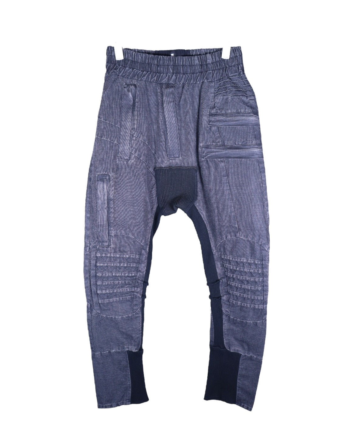 Vintage second-hand Demobaza charcoal-grey sweatpants/joggers in soft knit with a drop-crotch and tapered cuffed legs, elastic drawstring waist, ribbed insets at crotch and hems, moto-quilted knee panels and multi-seam patchwork. Avant-garde techwear/utility style, luxury designer and unique, laid flat on white.