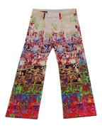 Vintage 1990s Jean Paul Gaultier multicolor graphic trousers/pants/jeans with comic-strip panels and pop-art slogans (“safe sex forever”), five-pocket, slim straight leg with button waist and belt loops. Luxury designer statement piece, rare and unique, laid flat on white.