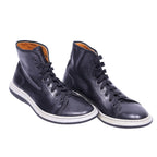 A pair of Gianfranco Ferre high-top leather sneakers with lace-up closure, displaying a black upper, white sole, and brown interior lining. Vintage Gianfranco Ferré black leather high-top sneakers/trainers — lace-up ankle shoes with round toe, padded collar, tan leather lining and contrast white rubber sole; minimalist Italian designer streetwear.
