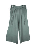 Second-hand Caravana sage-green bohemian pants/trousers in lightweight woven fabric; relaxed wide-leg palazzo/culotte cut with gathered waistband and adjustable side-tie fastenings, fluid drape and clean hems. Luxury artisan piece, rare and unique, laid flat on white.