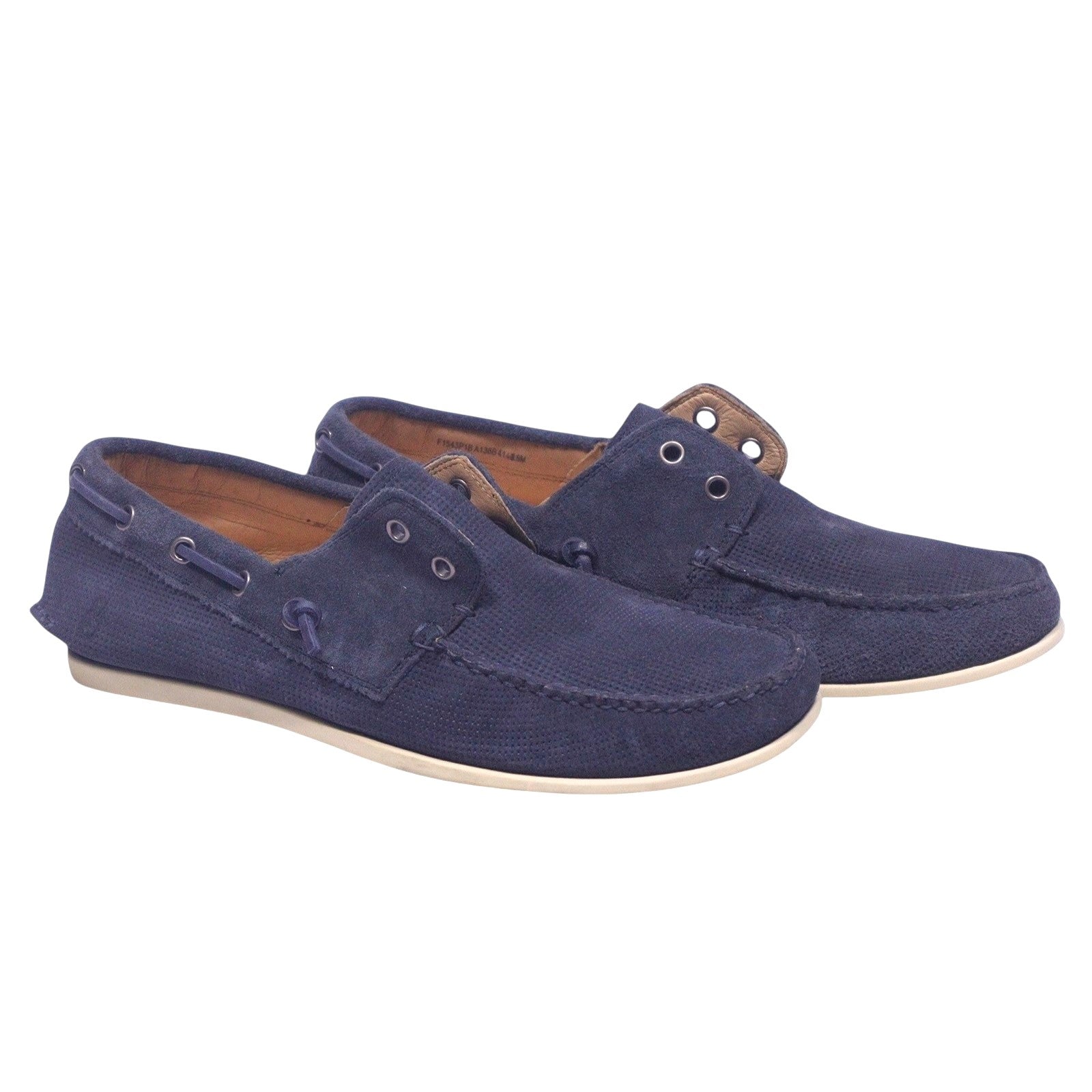 A pair of navy blue suede boat shoes with lace-up closures on a white background. John Varvatos Star USA navy blue boat shoes in textured suede, moc toe, collar-lacing detail, contrast stitching, and white rubber sole.