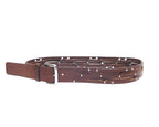 A brown leather belt with studded rivets and a metal buckle, displayed on a plain background. Vintage Yohji Yamamoto brown leather belt; Japanese avant-garde designer from Tokyo; slim/skinny layered wrap straps; silver-tone studded rivets; polished metal prong buckle; adjustable multi-hole fit; unisex styling for men or women; luxury artisan cowhide; rare limited piece; runway/punk/grunge/minimal vibe; perfect for jeans, trousers, or tailoring; premium Japanese craftsmanship