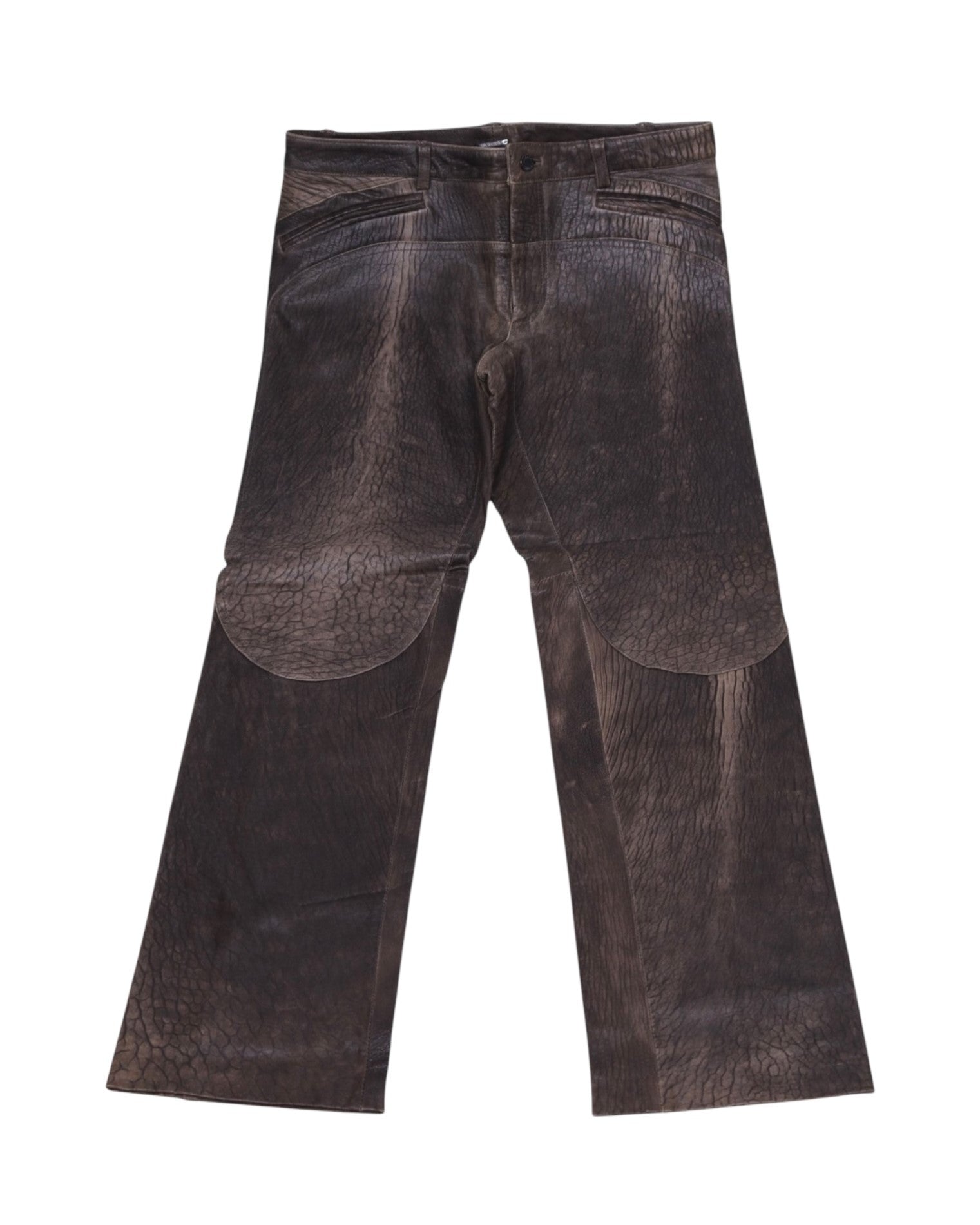 A pair of brown leather pants laid flat on a white background, showing the front view with pockets and belt loops. Vintage Roberto Cavalli dark-brown leather trousers/pants with rich textured grain and jeans-style waistband with belt loops and button waist. Straight/bootcut leg with oversized curved knee/thigh panels and gentle patina—luxury, rare piece laid flat on white.