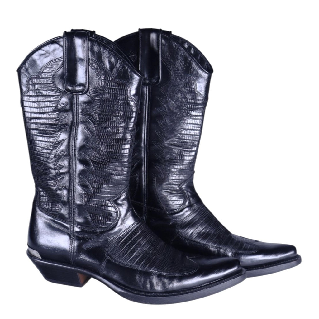 A pair of black leather glossy finish boots with embossed leather design. Roberto Cavalli black leather western Santiag boots with a glossy finish and embossed pattern, pull tabs, pointed toe and low Cuban heel. Vintage designer pair, rare.