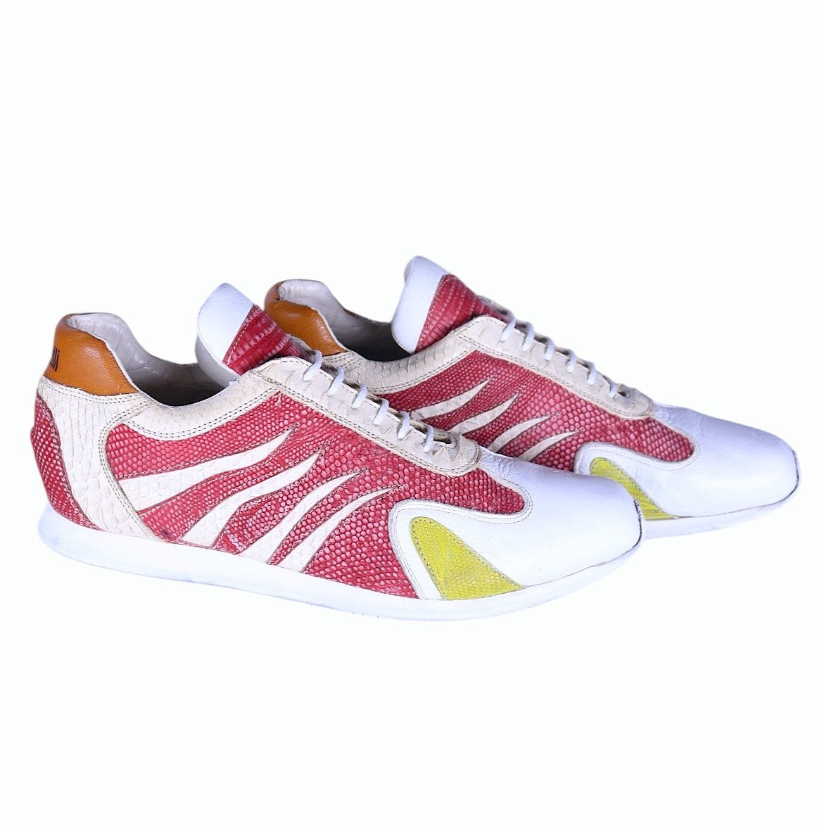 A pair of beige snakeskin leather shoes with red and yellow galucha leather accents. Roberto Cavalli low-top sneakers in cream/white with reptile-effect trims, red galuchat (pebble) panels and yellow toe accent, lace-up front and slim rubber sole; vintage designer, rare. leather  of rays and sharks.