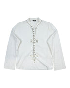 Voyage Mazzilli & Michielsens white/ivory long-sleeve shirt; band collar with notched V, textured cotton/linen feel; hand-embellished beaded/crystal floral placket in a vertical motif; relaxed easy fit, unisex; style with jeans, tailoring, leather; tags: boho, rock, festival, Y2K, romantic; Voyage (Europe, boutique studio craft, small-batch), collectible.