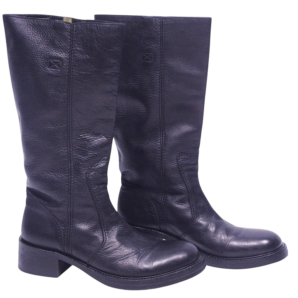 A pair of black tall leather boots with a low heel and no visible brand marking. Roberto Cavalli black tall leather boots with round toe, pull-on shaft, subtle logo stamp, and sturdy block heel.