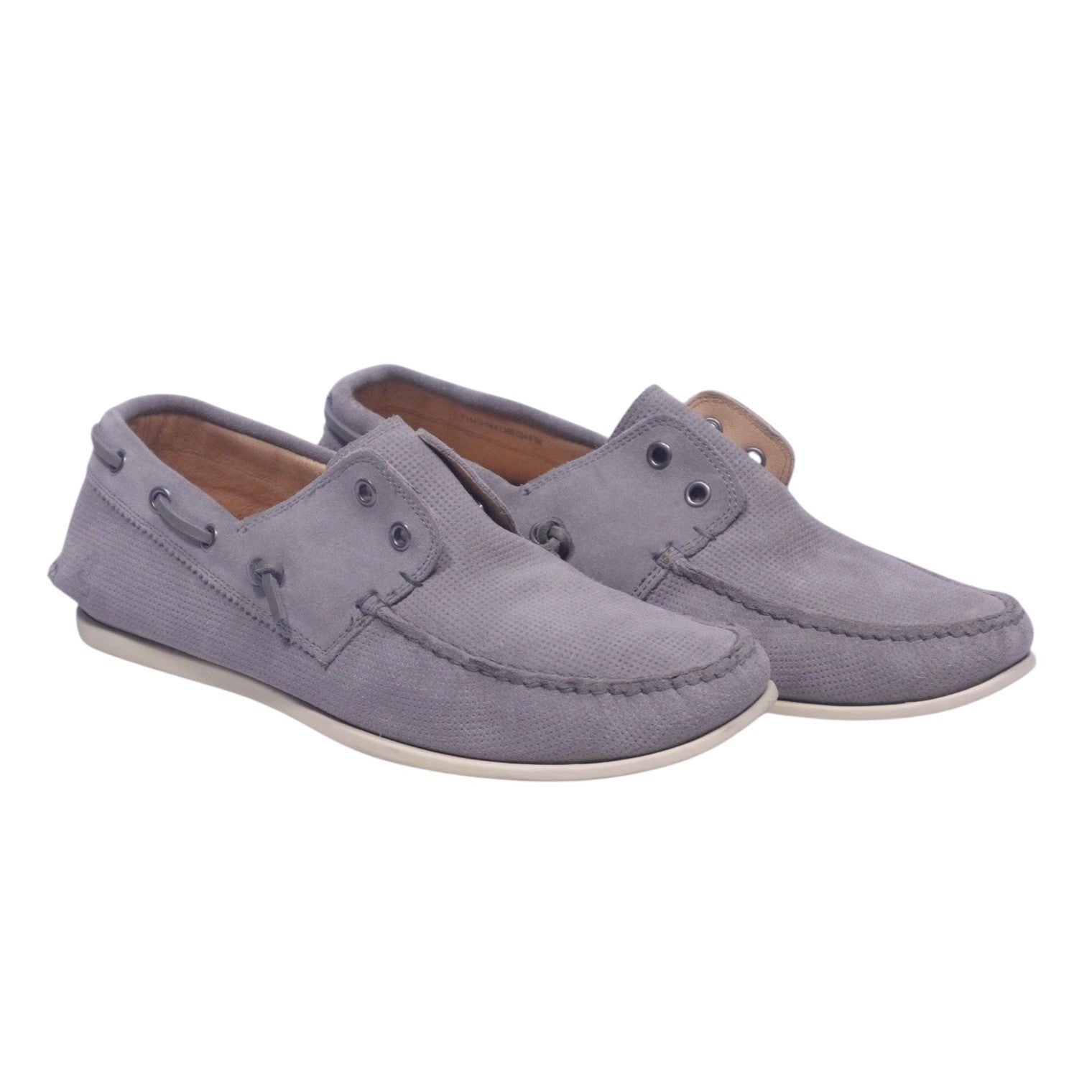 A pair of gray suede John Varvatos star USA boat shoes with rubber soles and lace-up closure. John Varvatos Star USA grey boat shoes with textured leather upper, moc-toe stitching and slip-on profile, featuring side grommets and collar-lacing detail. Low profile with off-white rubber soles; vintage designer, rare.