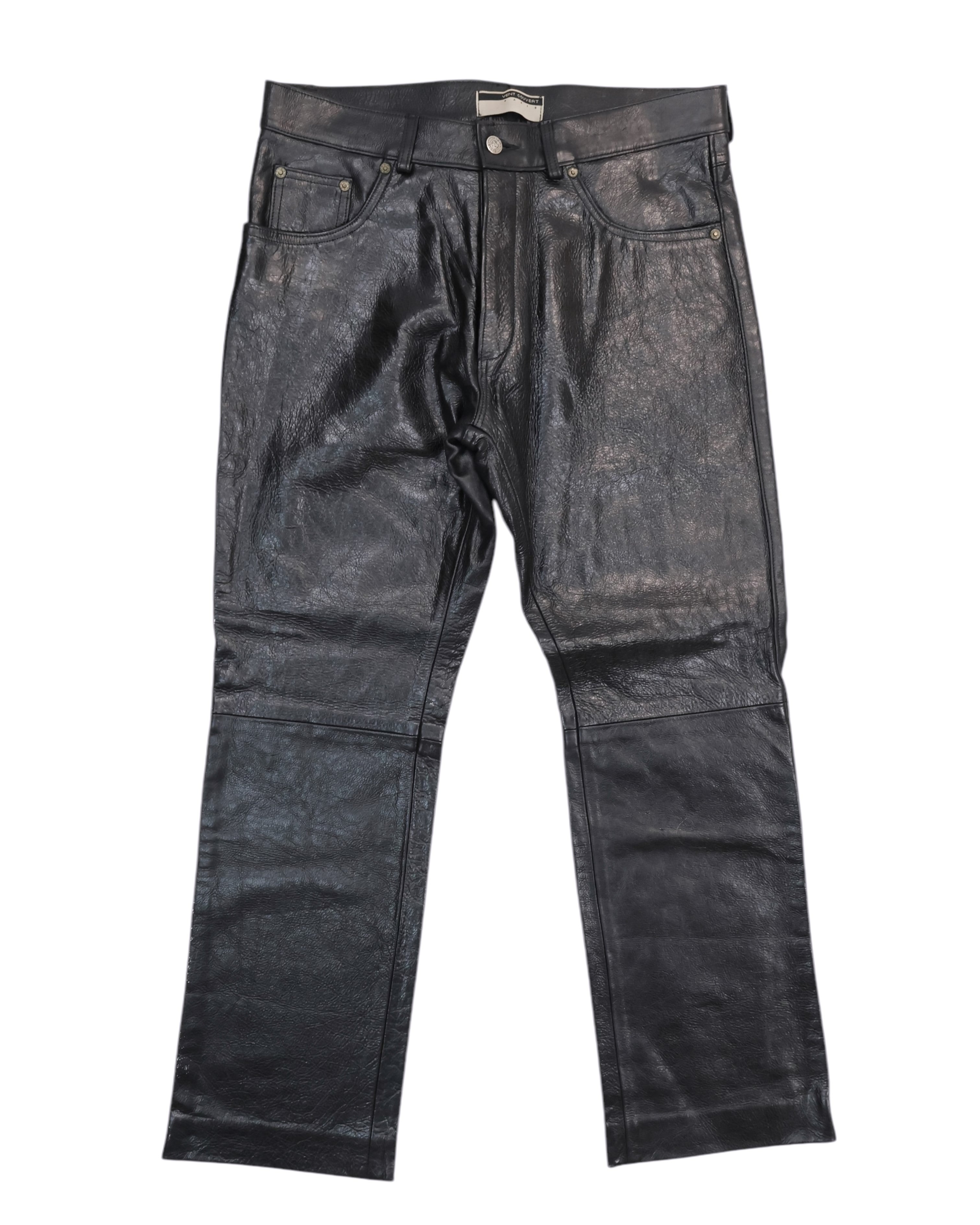 Black calfskin leather pants with a front zipper and button closure, displayed against a white background. Vent Couvert black calfskin leather pants in a straight, jean-style cut with five pockets, belt loops and zip fly. Panelled legs with horizontal seams and a subtle glossy finish; vintage, luxury, rare.