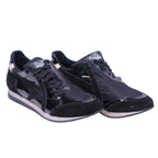 A pair of Dolce Gabbana leather suede sneakers in black color. Vintage D&G Dolce & Gabbana black low-top sneakers/trainers with mixed materials—smooth leather, suede and glossy patent overlays—mesh panels, lace-up front, logo tongue, gold heel tab, retro runner silhouette and cushioned white/black sole.