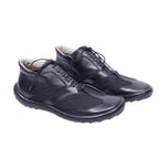 A pair of Gianfranco Ferre black leather shoes with lace-up closure. Black leather low-top sneakers with mesh inserts, lace-up front and rounded toe on a cushioned rubber sole. Gianfranco Ferre minimalist Italian design; vintage and rare.