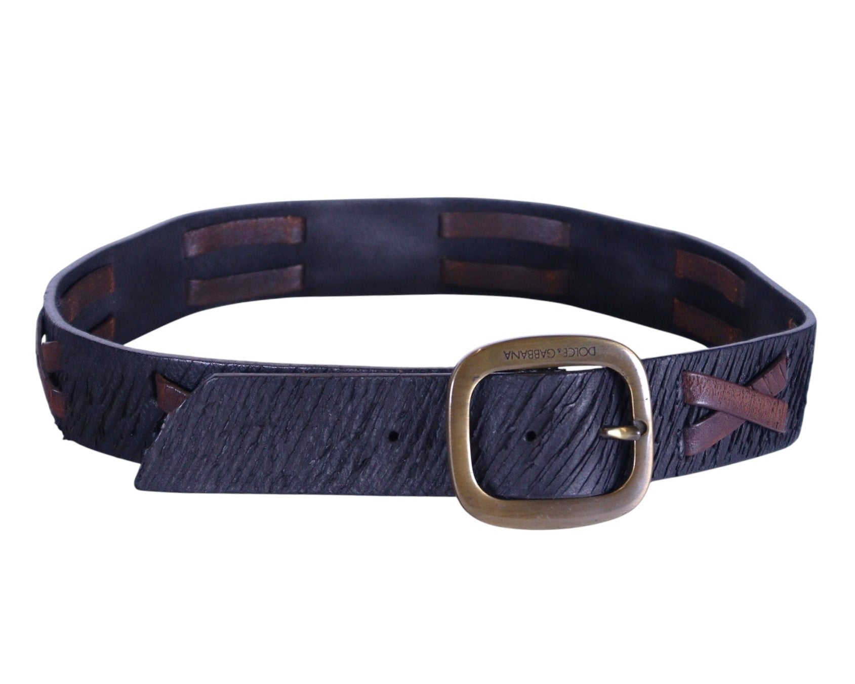 A black leather belt with brown cross-stitch accents and a gold-colored buckle. Dolce & Gabbana (Italian, Milanese luxury house) black genuine leather belt / waist strap / cinture in premium calfskin, textured grain, with brown contrast cross-stitch lacing through slotted panels, artisan hand-laced look, antique-brass oval buckle engraved “Dolce & Gabbana,” adjustable holes; designer/unisex accessory for jeans, chinos, or tailoring—refined, rugged, two-tone stitching, made in Italy.