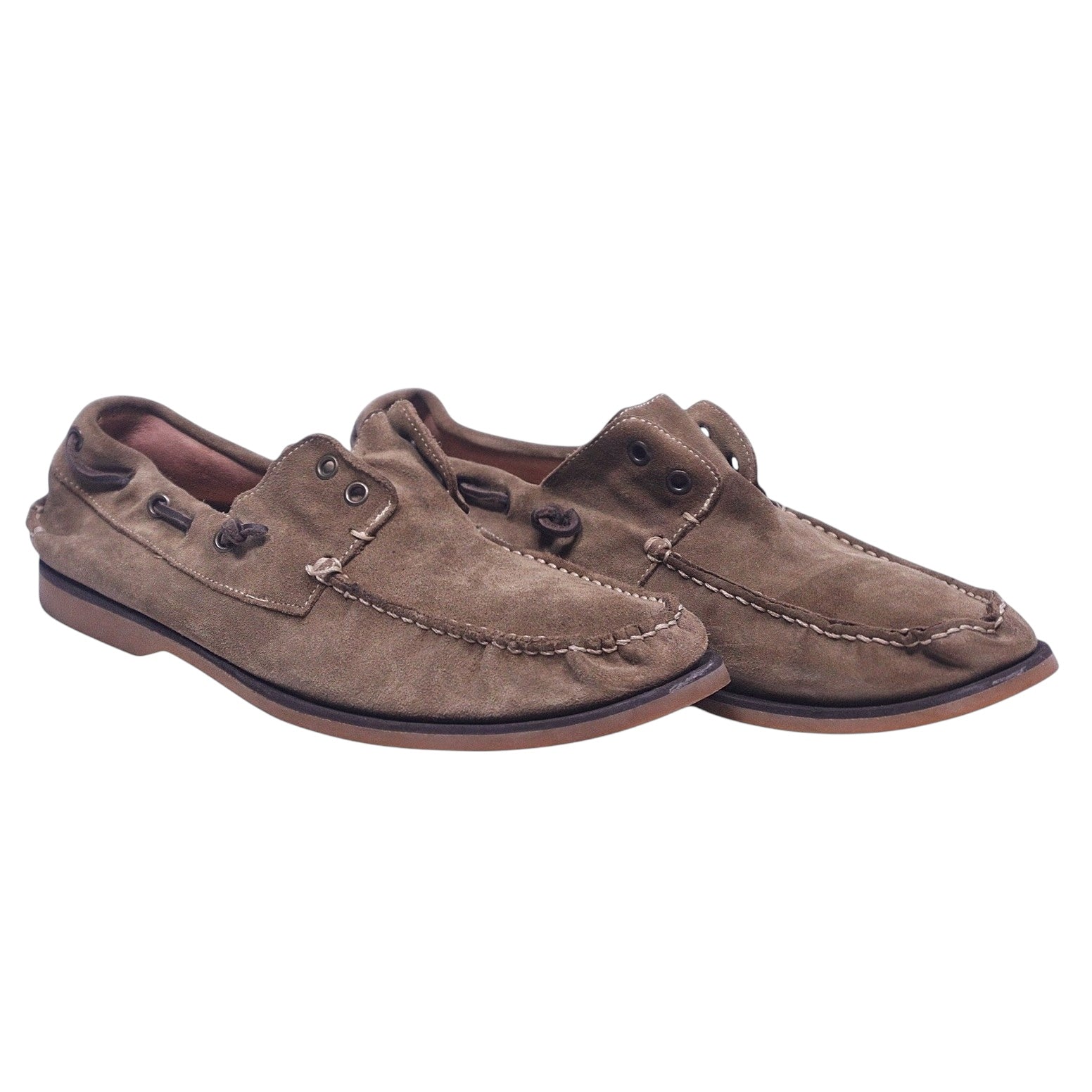 This image displays a pair of John Varvatos star USA brown boat shoes, size 10. The shoes feature a rugged suede construction in a shade of brown that suggests both style and durability.John Varvatos Star USA brown suede boat shoes with moc-toe, 360° rawhide lacing, contrast stitching, and grippy rubber deck sole.
