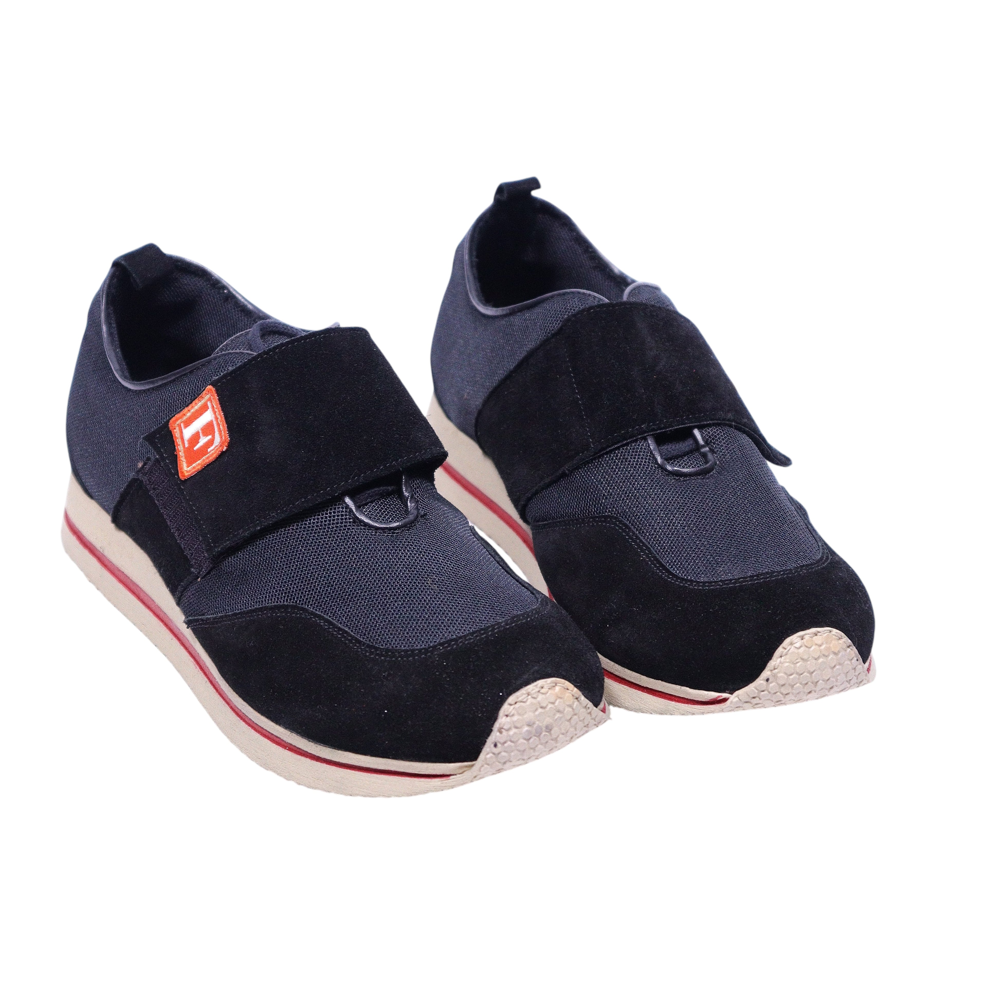 A pair of Gianfranco Ferre Sport shoes with navy upper material, white sole, and red detailing. Gianfranco Ferré Sport navy sneakers with mesh knit uppers, suede overlays and a wide Velcro strap, rounded toe and textured rubber sole with red stripe. Sleek sport-casual trainer; vintage designer, rare.