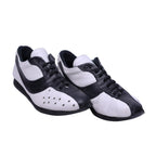 A pair of Dolce Gabbana black and white leather shoes with lace-up closure. Dolce & Gabbana low-top lace-up sneakers in black and white leather with contrast panels, perforated toe detail and a slim rubber sole. Retro racing-inspired, Italian designer pair; vintage and rare.