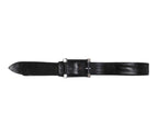 L’Eclaireur black leather belt; French label from Paris known for avant-garde curation and artisanal collaborations; genuine leather/cowhide/calfskin strap in jet-black with natural grain and subtle patina; rectangular leather-covered buckle framed by four silver-tone corner tabs/studs; minimalist yet rugged, adjustable waist strap; luxury designer accessory for jeans, chinos, suits or dresses Parisian craftsmanship, premium quality, collectible vintage piece.