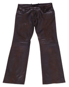 Vintage Dolce & Gabbana  Distressed dark brown leather pants/trousers with a smooth glossy finish, mid-rise straight-to-bootcut leg, jeans-style front pockets, belt loops and button front, subtle knee panel seams and gentle patina. Luxury designer, rare and unique, laid flat on white.