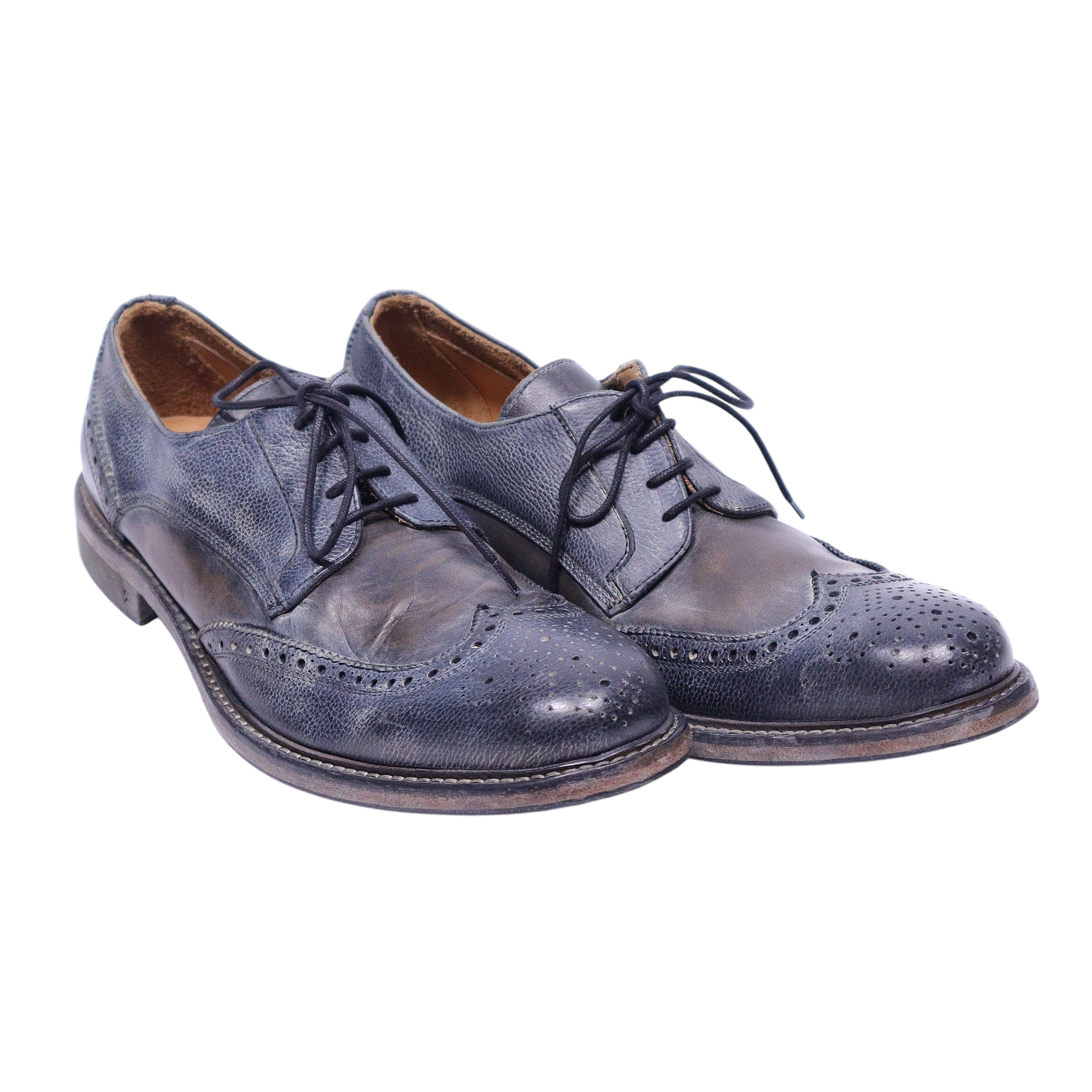 A pair of John Varvatos wingtip brogue shoes with laces, isolated on a white background. John Varvatos dark navy leather wingtip brogue derby shoes with open lacing, round toe and stacked sole. Lightly distressed finish with vintage patina; designer, rare.