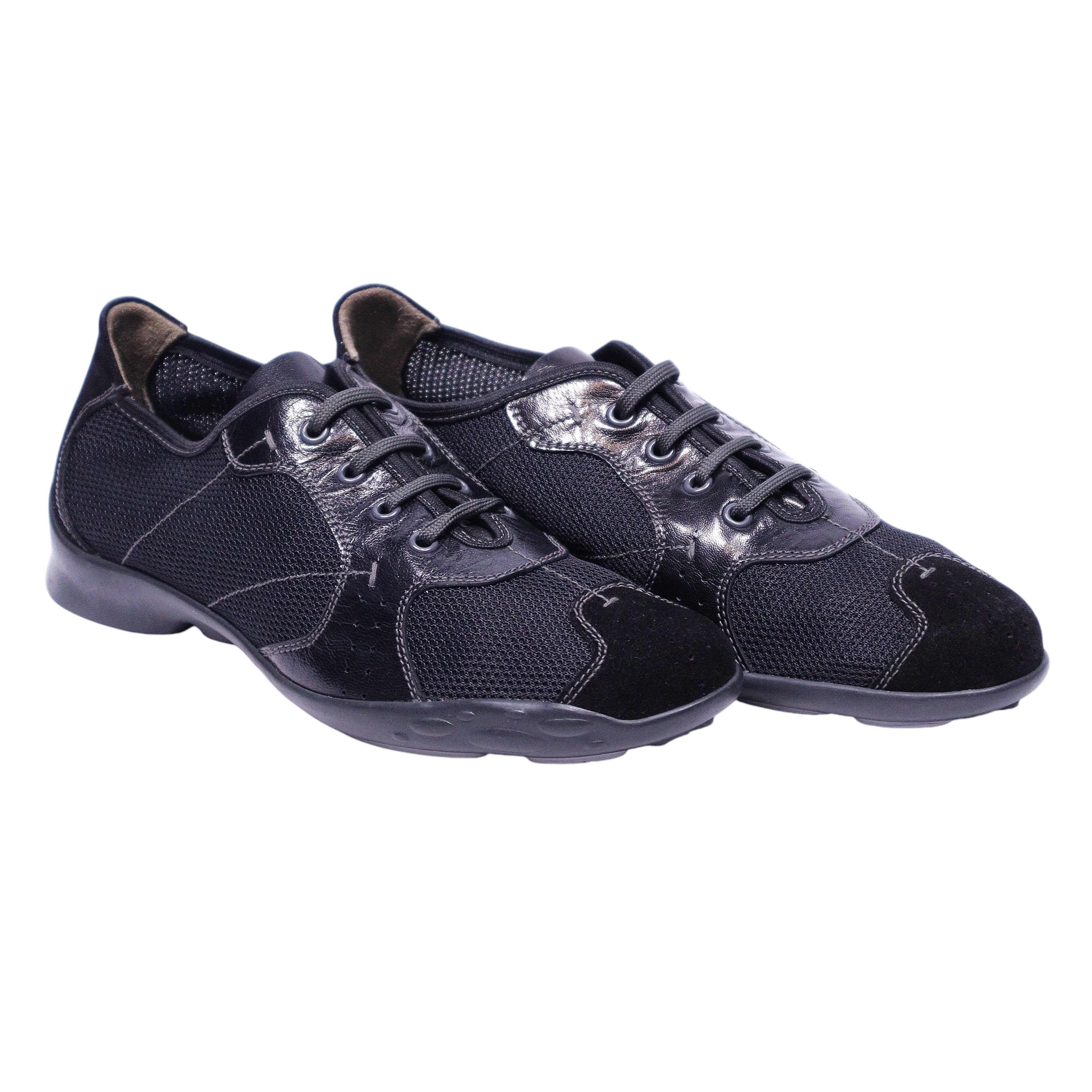 A pair of Prada Linea Rossa black sneakers with lace-up closure. Prada Linea Rossa black low-top sneakers with mesh uppers and suede/leather overlays, lace-up front, rounded toe and lightweight rubber sole; sleek tech-sport, vintage designer, rare.