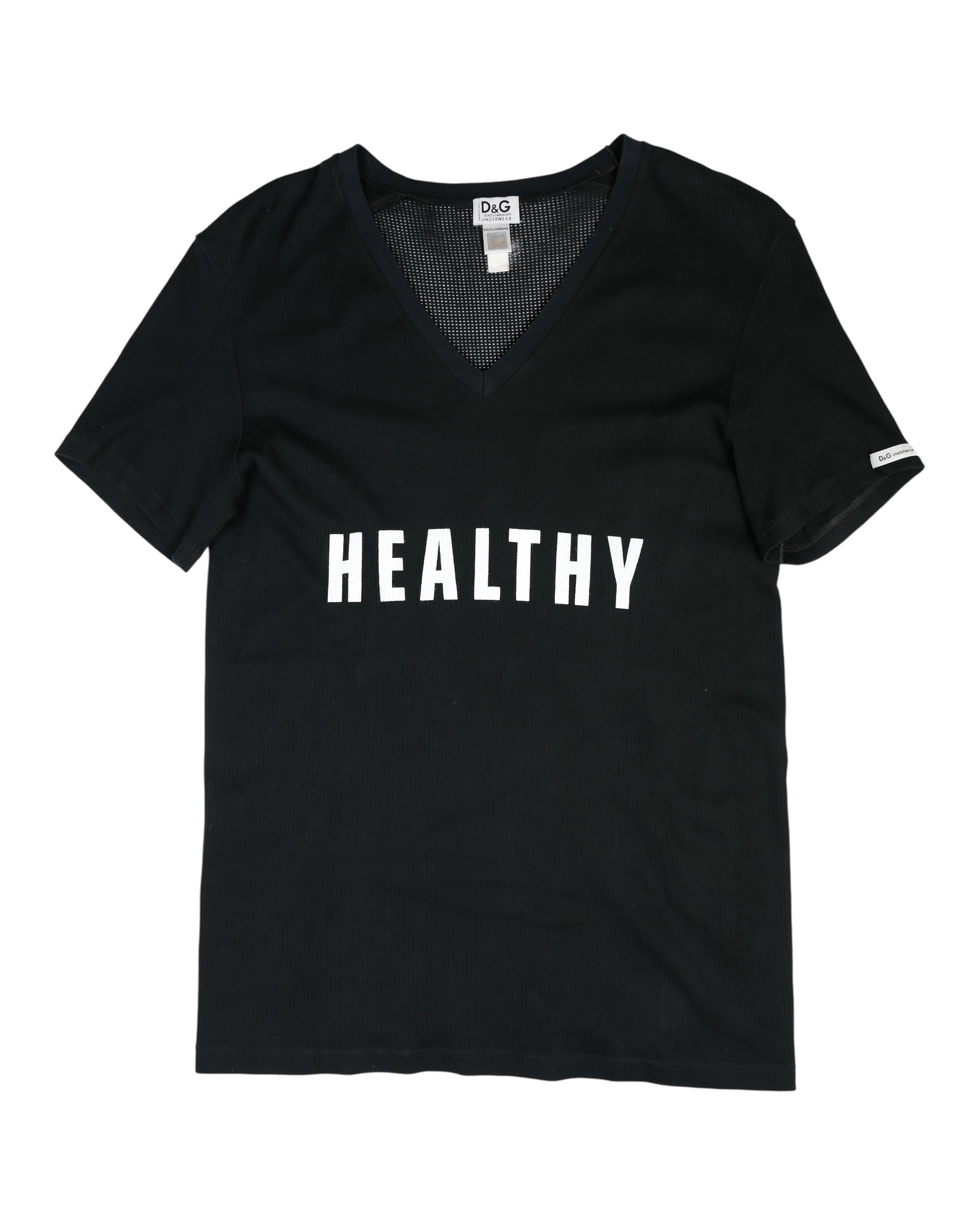 Black t-shirt with 'HEALTHY' printed on it against a white background Dolce & Gabbana Underwear black V-neck T-shirt / tee / top; short-sleeve ribbed stretch cotton jersey with mesh panel at neckline, bold white “HEALTHY” chest slogan; slim-fit, breathable, unisex; perfect for streetwear, athleisure, layering, lounge or gym; Y2K/sporty/minimal; Italian luxury diffusion line from Milan.
