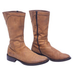 A pair of tan-beige tall leather boots with a low heel and visible stitching. Tall tan-beige leather boots with a side zip, round toe and low stacked heel. Smooth leather shaft with a lightly worn patina; vintage designer pair, rare and timeless. roberto cavalli