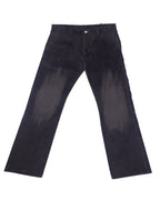 A pair of black Under Cover Jun Takahashi pants laid out flat against a white background. Undercover by Jun Takahashi dark charcoal trousers with straight, slightly flared legs; flat front, belt loops, side pockets and a zip fly. Soft woven finish with subtle brushed fade—vintage, designer, rare.