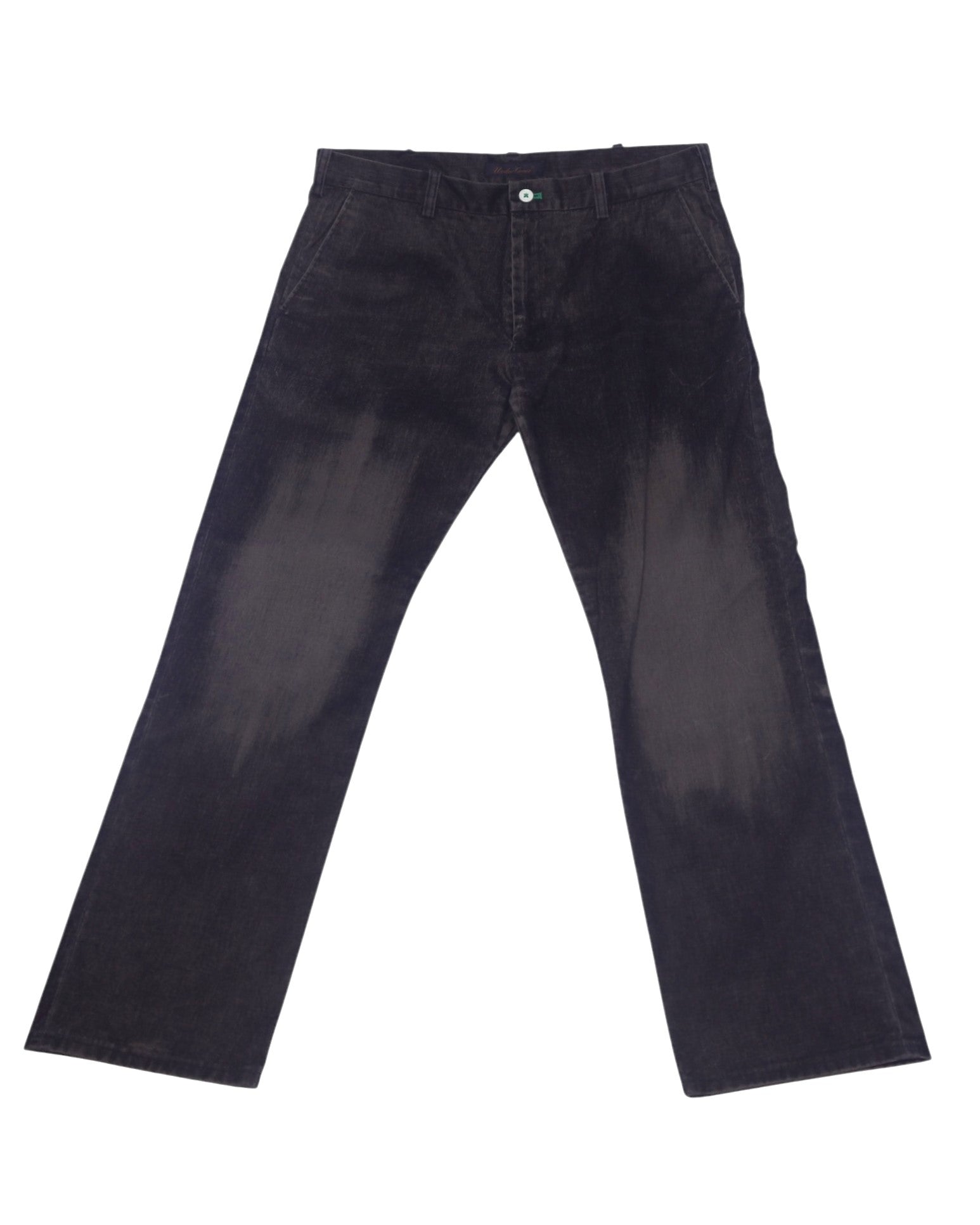 A pair of black Under Cover Jun Takahashi pants laid out flat against a white background. Undercover by Jun Takahashi dark charcoal trousers with straight, slightly flared legs; flat front, belt loops, side pockets and a zip fly. Soft woven finish with subtle brushed fade—vintage, designer, rare.