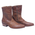 A pair of tan-brown santiag boots with stitching details and a visible zipper on the side. Roberto Cavalli tan-brown leather western santiag boots with contrast stitching, pointed toe, mid-calf shaft, side zip, and stacked heel.