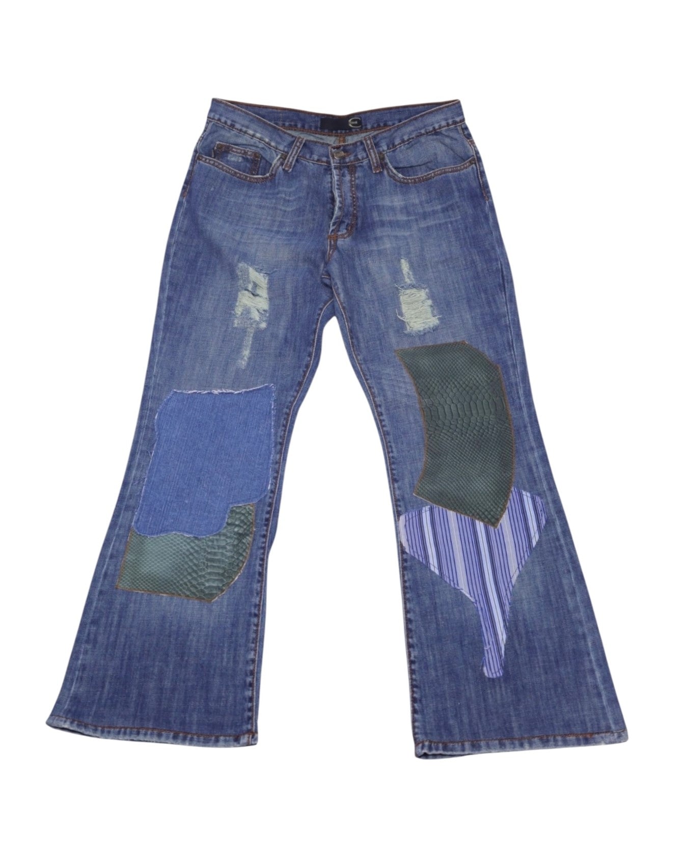A pair of Roberto Cavalli patchwork jeans with various colored patches on the denim fabric. Vintage Roberto Cavalli blue patchwork jeans/denim trousers with large mixed-fabric appliqué panels (striped and reptile-effect), light distressing and fading. Mid-rise five-pocket with straight-to-flare leg and button waist; luxury, rare and unique.
