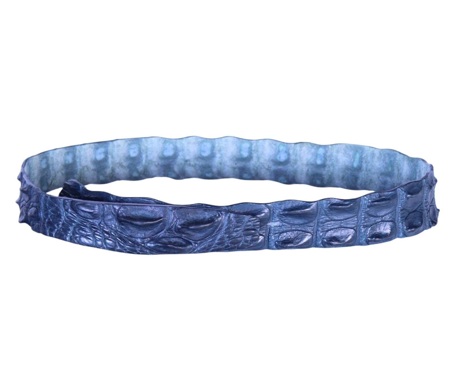 A dark blue crocodile pattern belt by Roberto Cavalli. Roberto Cavalli dark blue/navy/indigo crocodile leather belt; exotic raised-scale texture, slim streamlined strap, clean edges; discreet closure/tonal finish; unisex; perfect with jeans, tailoring, western looks, streetwear or evening; style tags: rock, luxe, western, statement, Y2K; Italian luxury house from Florence, artisanal craftsmanship; vintage, rare, collector piece.