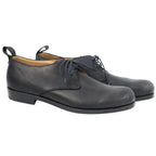 Jil Sander black matte leather derby shoes—minimalist lace-up dress shoes with rounded toe, rear pull tabs, and low stacked heel (men’s).