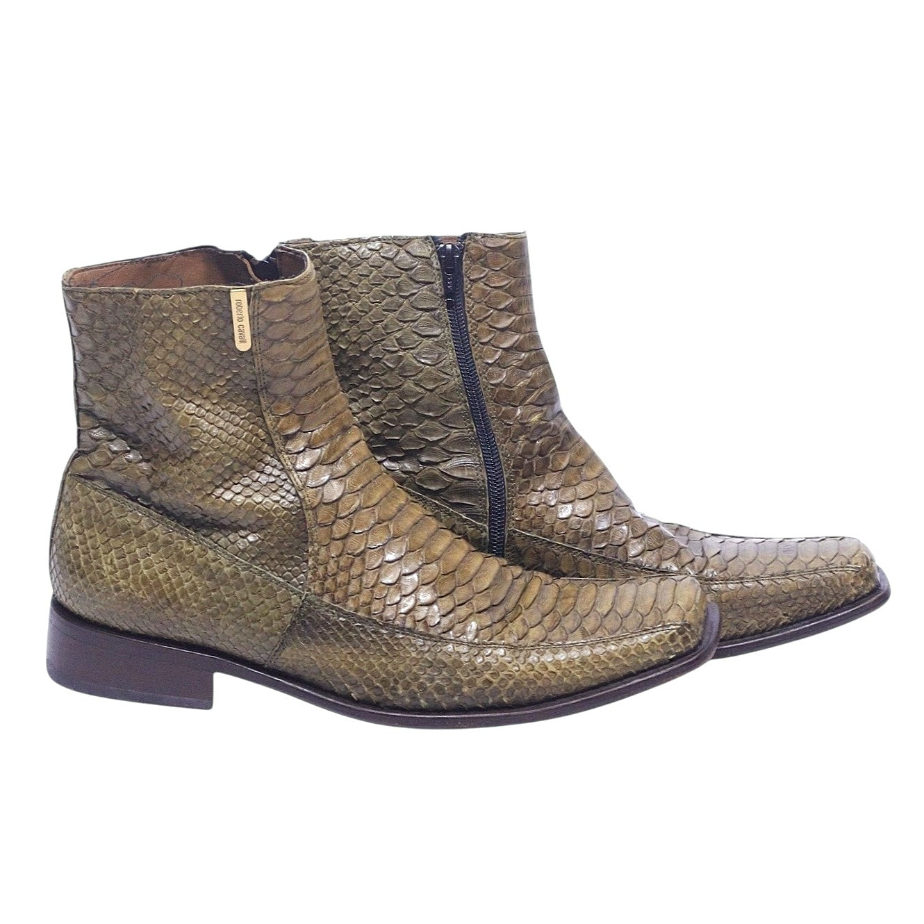 A pair of green python leather boots with a zipper on the side. Green snake-effect leather ankle boots in a western santiag silhouette with pointed toe, side zip and low stacked heel. Textured reptile finish, Italian designer piece; vintage and rare.