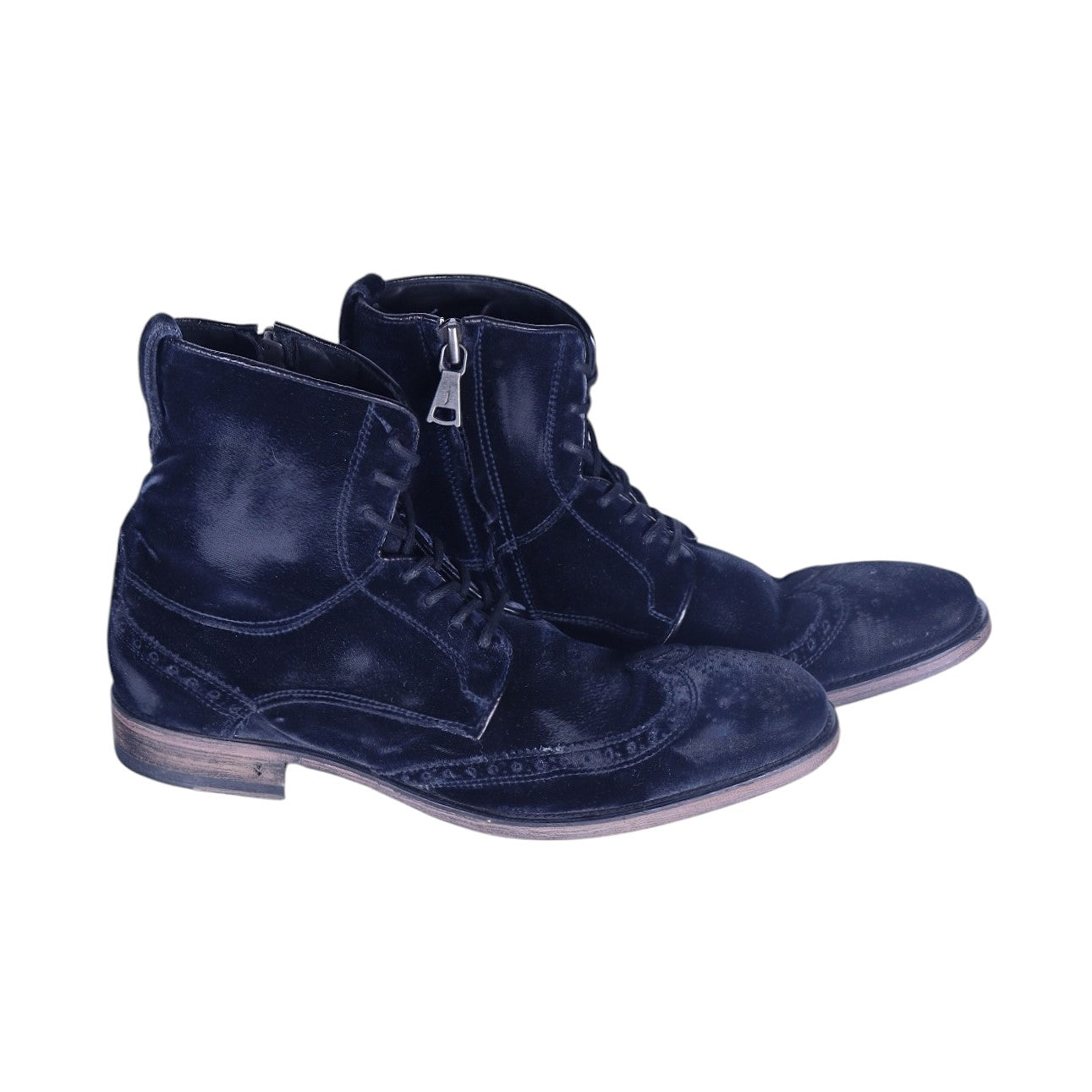 A pair of men's black velvet wingtip boots with lace-up closure and a zipper on the side. John Varvatos midnight-black velvet lace-up boots with brogue wingtip detailing, side zip, almond toe and stacked sole; softly distressed finish, vintage designer, rare.