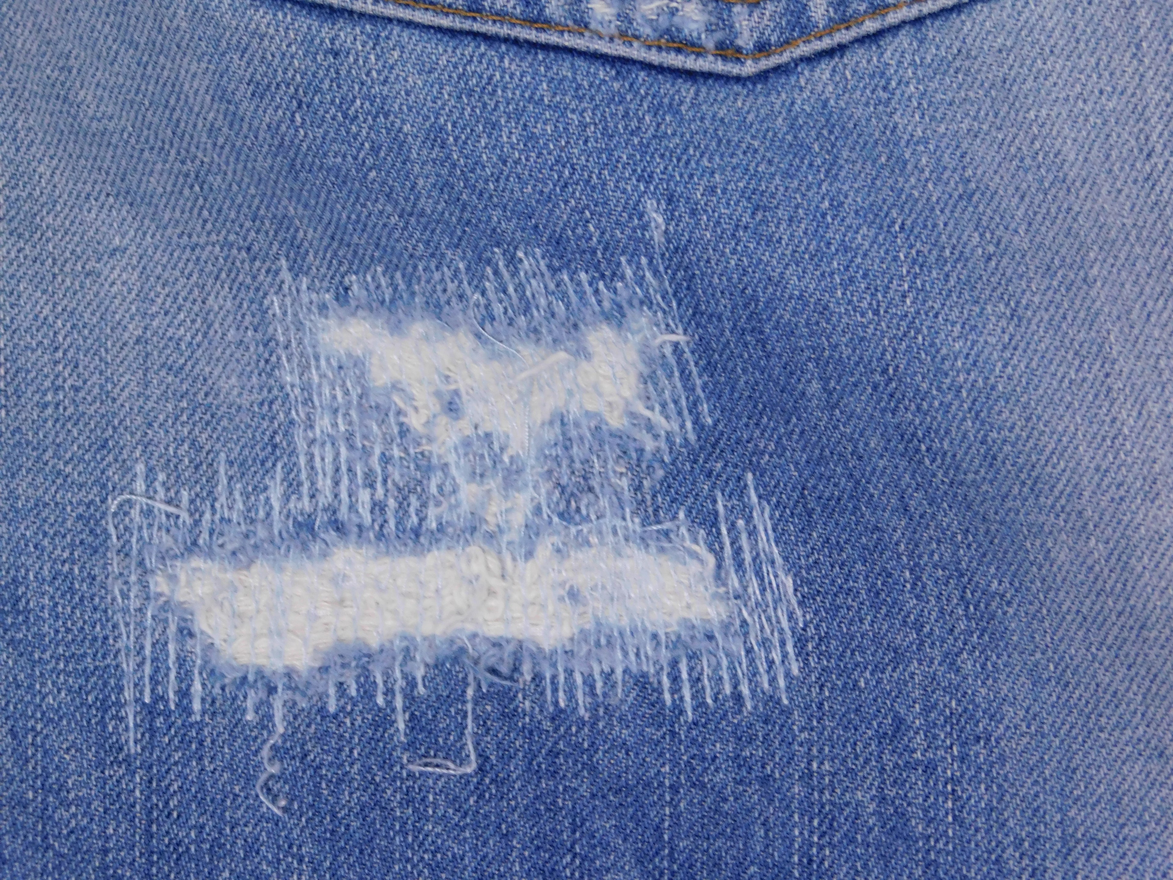 Roberto Cavalli ripped jeans with charms