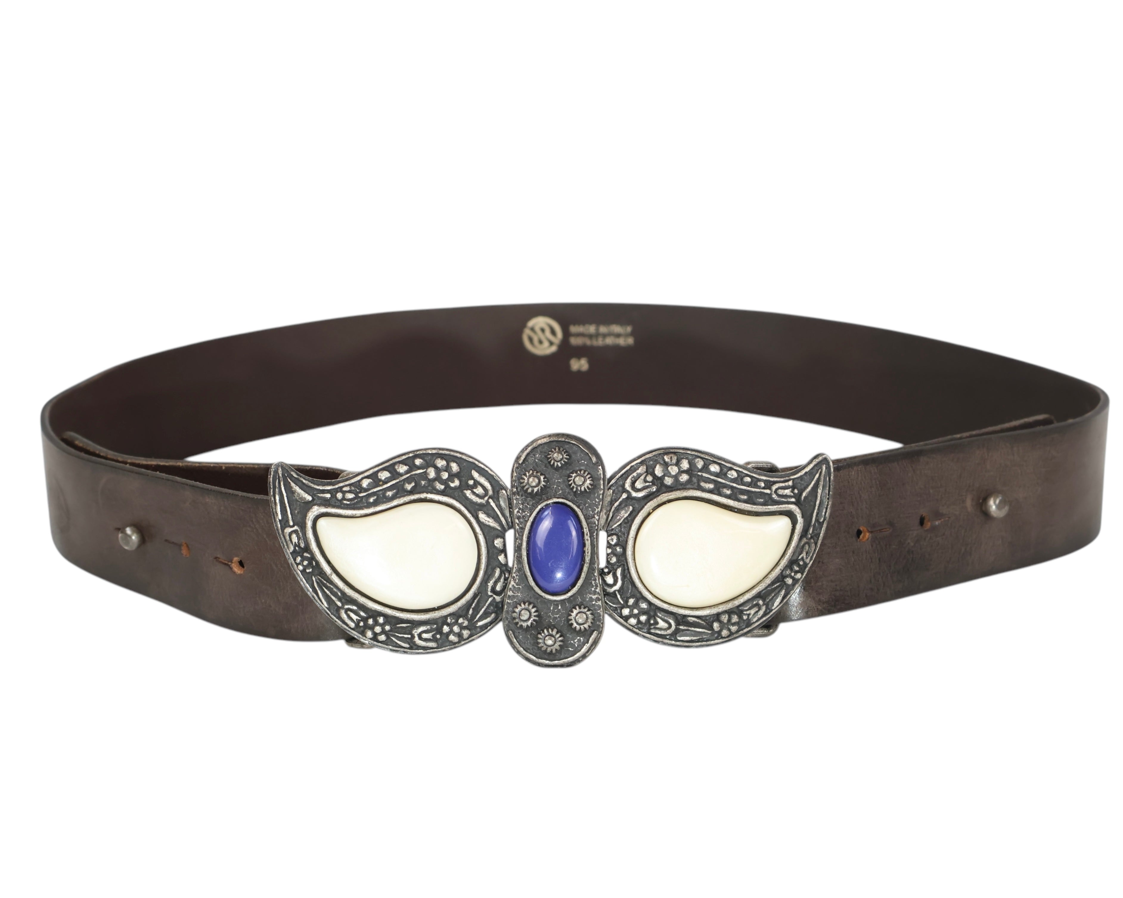 A brown leather belt with a paisley-shaped stone buckle featuring silver and blue colors. Roberto Cavalli dark brown leather belt / waist strap; ornate silver-tone buckle in paisley shapes with cream stone inlays and a central blue cabochon; engraved floral detailing; unisex; great with jeans, tailoring or boho fits; style tags: western, rock, Y2K, statement; Italian luxury house from Florence, artisanal craft; rare vintage.